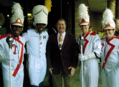  Dr. Moss with FMB Drum Majors and Univ. of Michigan Drum Major.  