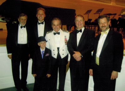  Richard Mathey, Shawn Mathey, Col. Arnald Gabriel, Dr. Moss, and Pete Friedmann. The boy pictured here (first name Geoff) was a trumpet soloist!   